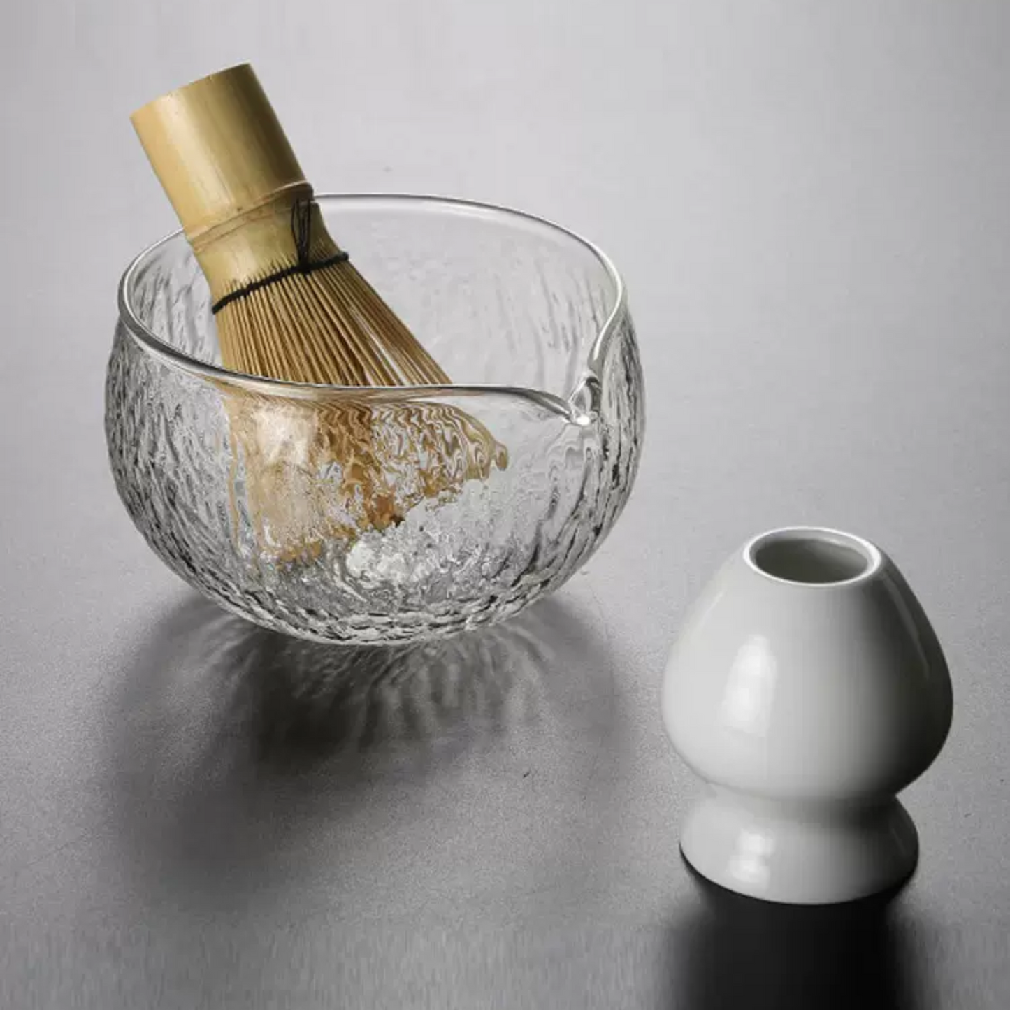 Experience the blend of tradition and modernity with a matcha bowl, whisk, holder, and scoop. Perfect for ceremonial tea rituals and gifting.