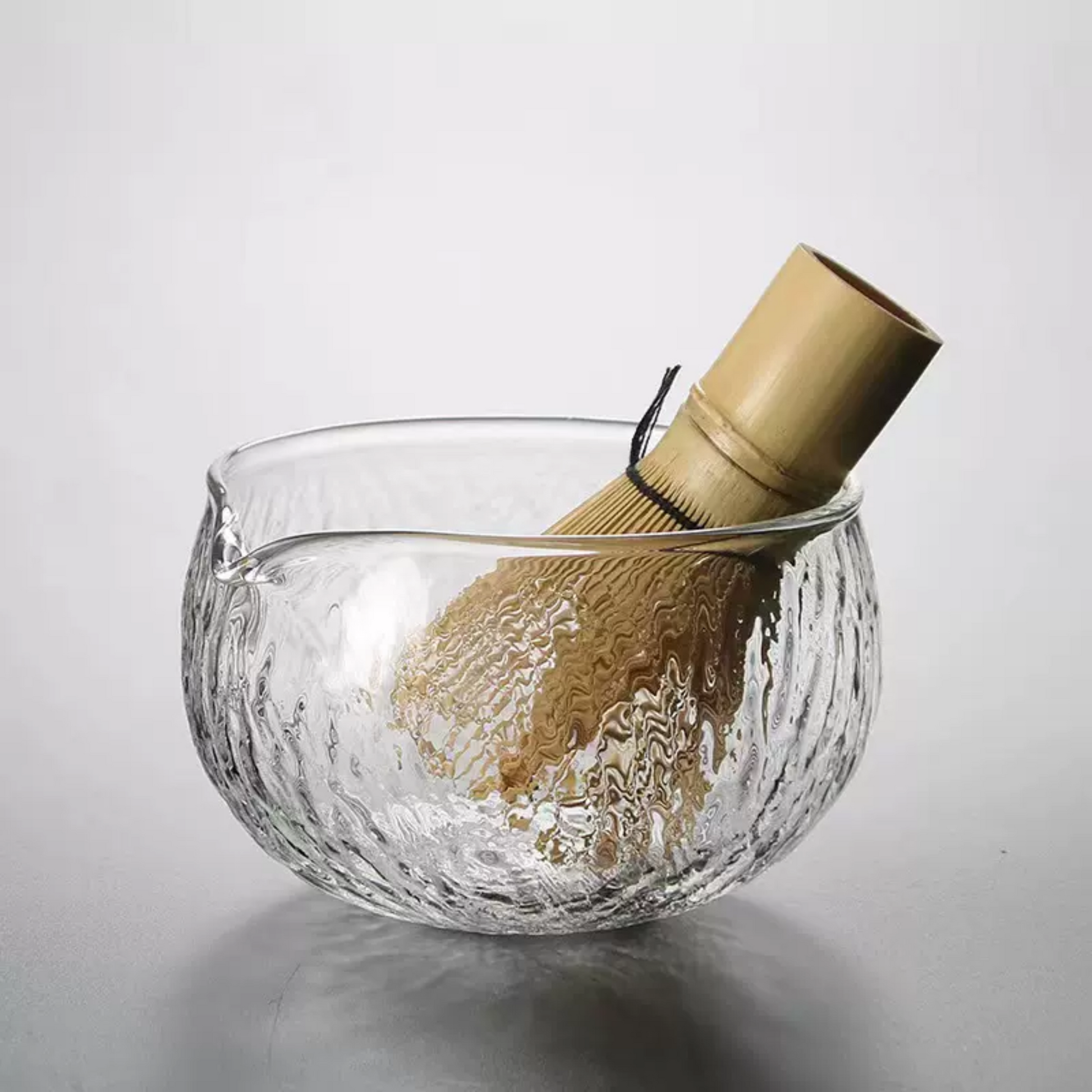 Experience the blend of tradition and modernity with a matcha bowl, whisk, holder, and scoop. Perfect for ceremonial tea rituals and gifting.