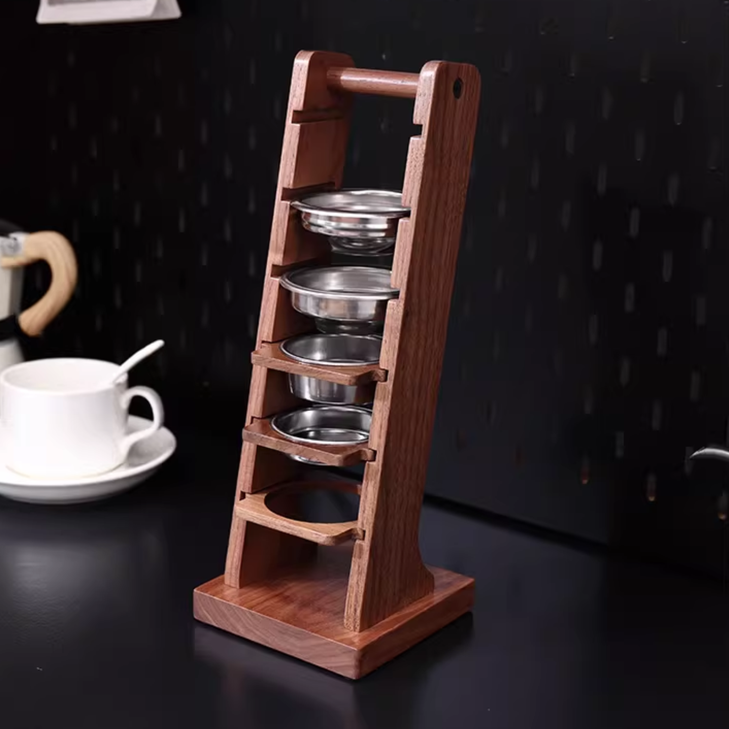 Multi-slot black walnut stand for espresso filter baskets, keeping coffee station tidy.