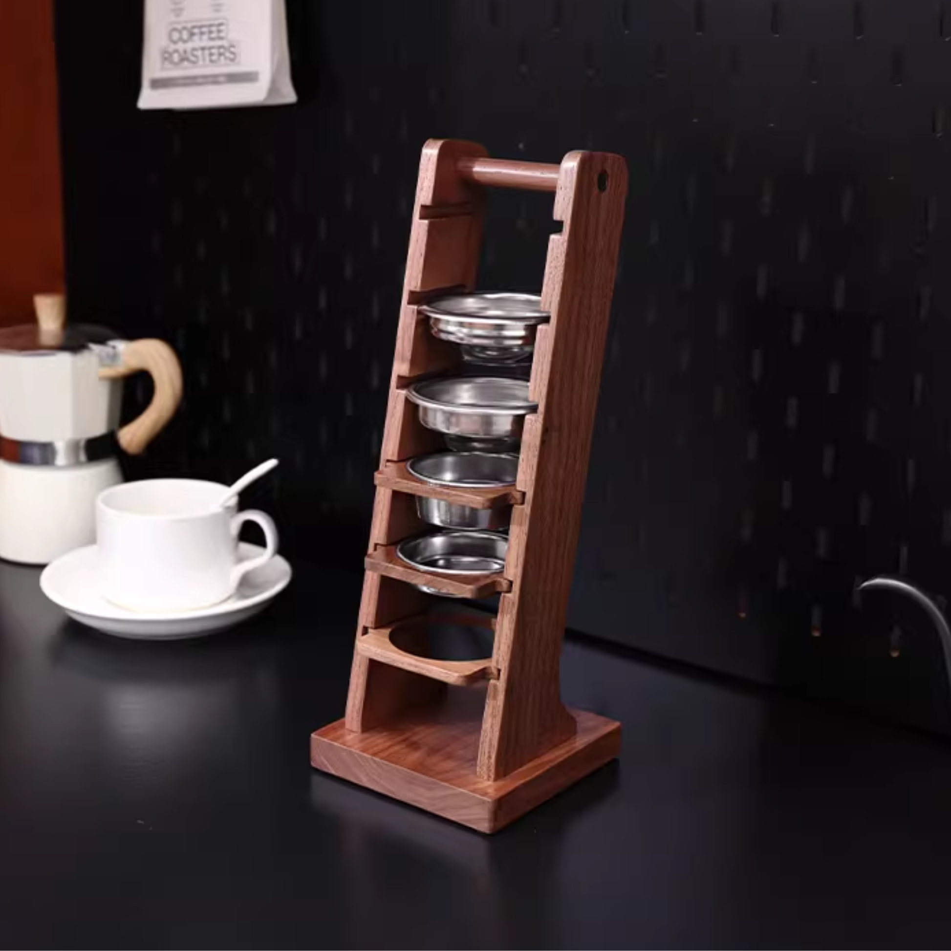 Stylish espresso basket rack with puck screen holder for home coffee bar setup.