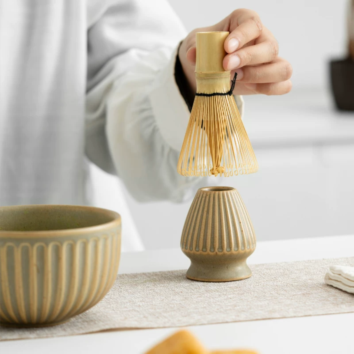 Handmade Ceramic Matcha Set with bamboo whisk, scoop and whisk holder on minimalist background
