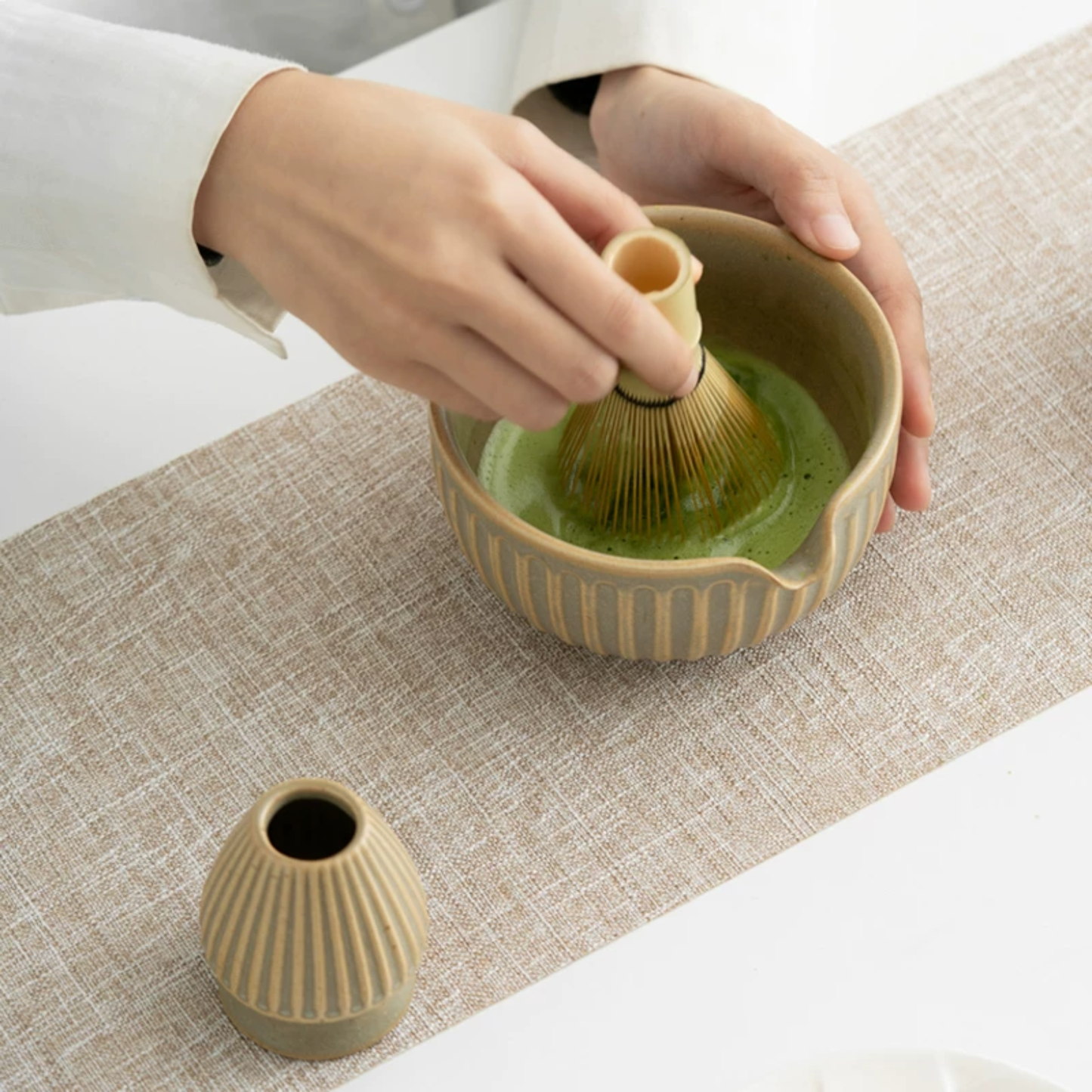 Sunflower-inspired ceramic matcha bowl with integrated pouring spout for smooth, spill-free whisking